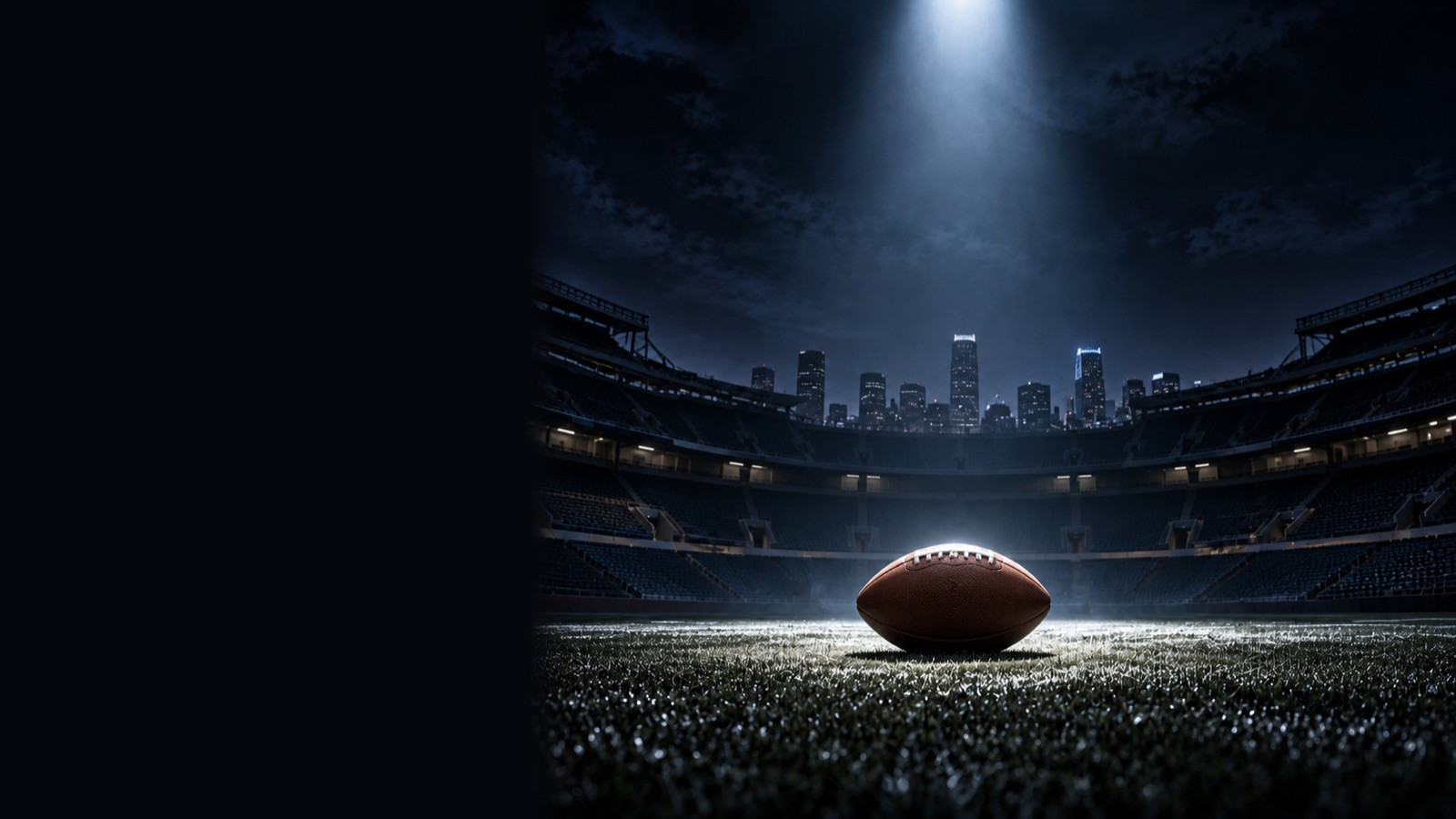 Football at midfield in an empty stadium under one spotlight